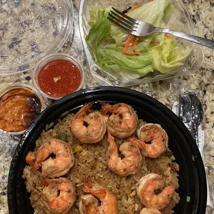 Shrimp over bacon fried rice.