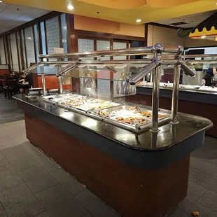 A buffet stand with seafood and meat
