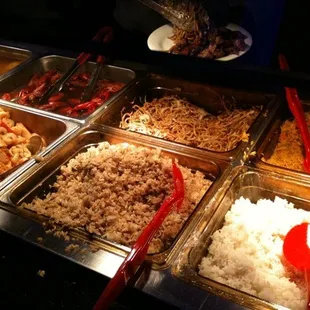 (Clockwise, from bottom left): Hibachi rice, lo mein, fried rice, and white rice