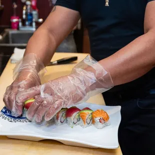 a man preparing sushi