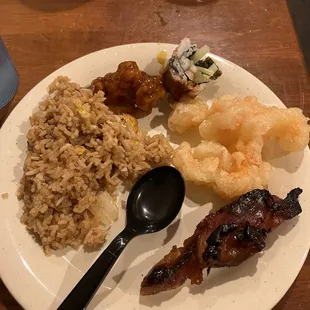 Chicken, sushi, coconut shrimp, and teppanyaki rice