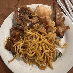 Fried squid, coconut shrimp, chicken, more chicken, and noodles