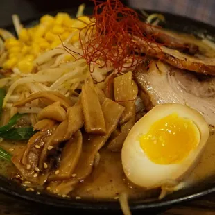 a bowl of ramen with a hard boiled egg