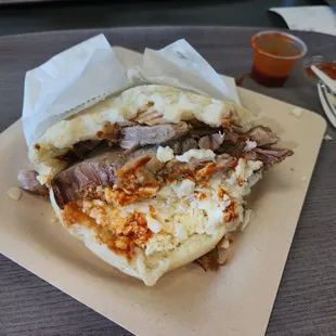There signature item is Arepa's (sandwiches made with cornmeal flatbread and filled with meat or beans).  This is the pork version.