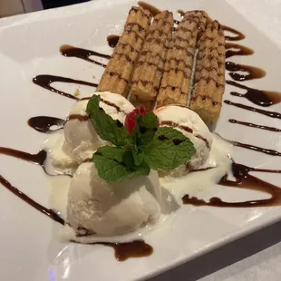 a desert with ice cream and chocolate sauce