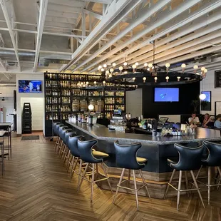 a bar with chairs and tables