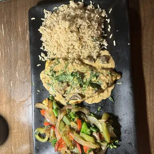 Red snapper, seafood of the day with cilantro rice and grilled veggies