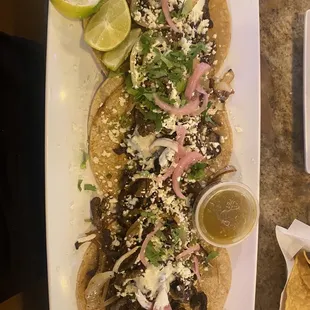 a plate of tacos and chips