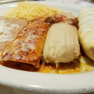 Enchilada, tamale, and chimichanga with rice and beans