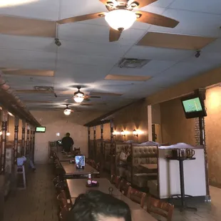 a row of tables and a ceiling fan