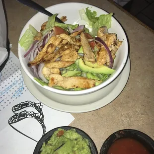 a bowl of chicken and guacamole