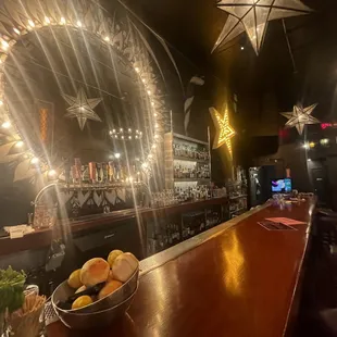 a bar with a bowl of fruit on the bar
