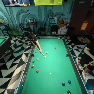 2 pool tables, darts, punching bag