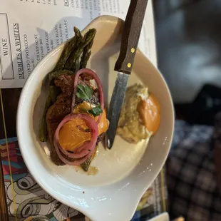 a plate of food and a knife