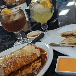 Massive burrito mojado and perfectly simple quesadillas - carnitas for both.
