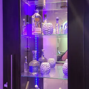 Liquor Bottles and Pottery Display