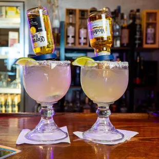 two margaritas on a bar