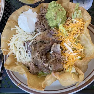 Tostada salad with carnitas