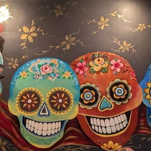 three sugar skulls