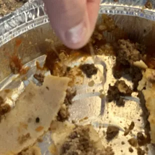 Enchilada with a piece of plastic in it