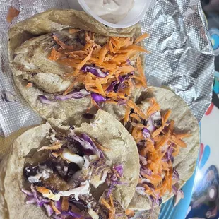 two tacos with coleslaw slaw