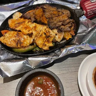 Combination fajitas with chicken, Carne Asada, shrimp, and veggies. Lots of flavor!