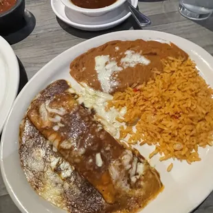 Cheese enchilada with red sauce. A little sweet like a mole.