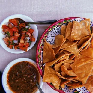 a bowl of chips and a bowl of salsa