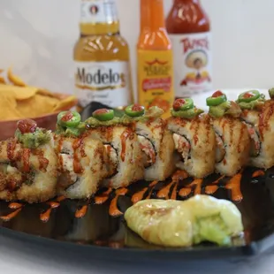 a sushi roll on a black plate