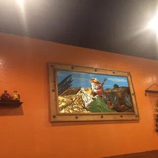 a painting on a wall in a mexican restaurant