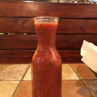 a bottle of salsa on a table