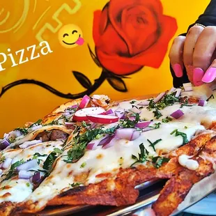  a person cutting a pizza