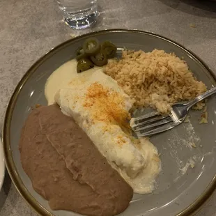 2 chicken sour cream enchiladas with beans and rice.