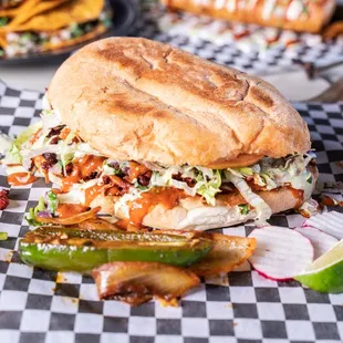 a sandwich on a checkered paper