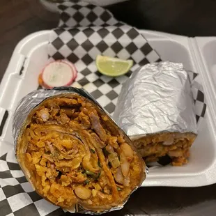 Burrito Super carnitas - so good !  And glad they cut it in half too