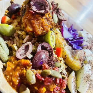 Djollof rice with mixed vegetables served with Tata Umu's tomato sauce w/tamarind baobab Chicken drumsticks &amp; eggs