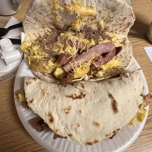 Teran&apos;s taco   Ham , bacon , cheese , beans , potato and egg .