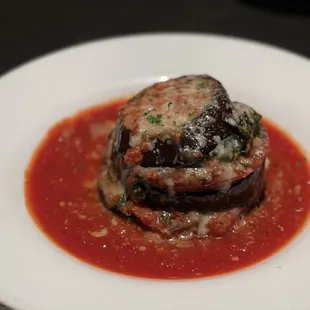 Melanzane- Layers of grilled eggplant, tomato, spinach, mozzarella, and grana padano cheese.