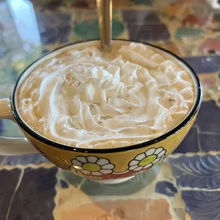 a cup of coffee with whipped cream