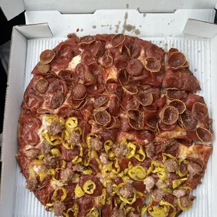 Split large pizza pepperoni and half with sausage and banana peppers.