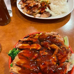 Top: chicken teriyaki and wok combo with general tso&apos;s Bottom: Spicy chicken teriyaki rice bowl