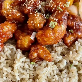 Sweet &amp; sour chicken with brown rice. They also included a small lettuce salad.