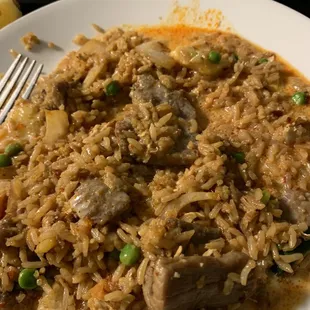 Meal on a plate: F4. Pineapple Fried Rice with curry sauce poured on top.