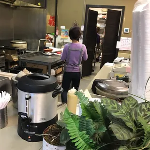 a woman in a kitchen