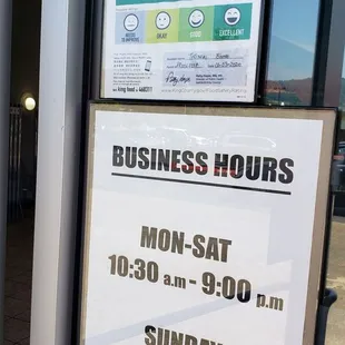 a business hours sign