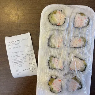 a sushi roll and a receipt