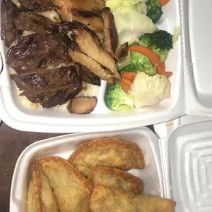 Beef and chicken teriyaki plate with a side of dumplings