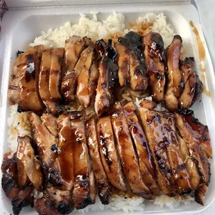 chicken and rice in a styrofoam container