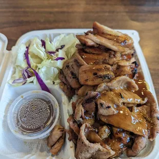 a plate of meat and vegetables