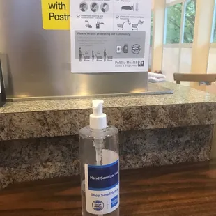 a bottle of hand sanitizer on a counter